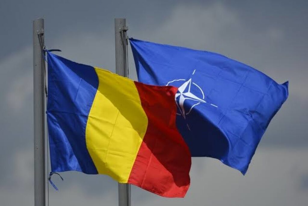 прапори Румунії та НАТО